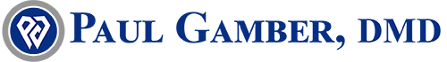 The image shows a logo with text that reads  Paul Gamber, DMD  accompanied by a graphic element resembling a stylized letter  P  and a tagline below it that says  Your Smile is Our Passion.