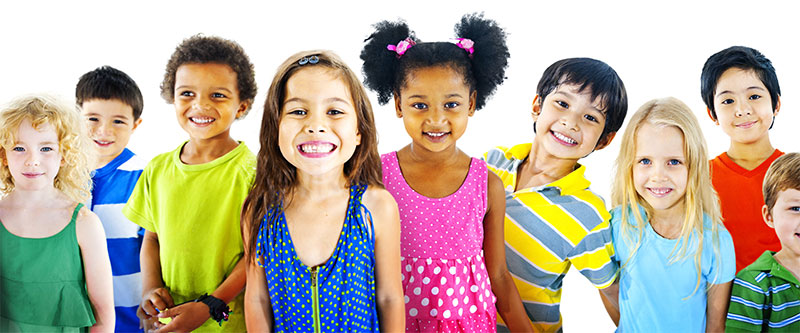 Children of various ages and ethnicities posing together with smiles.